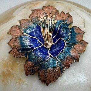 Vintage cloisonné hibiscus flower brooch with blue and copper enamel.